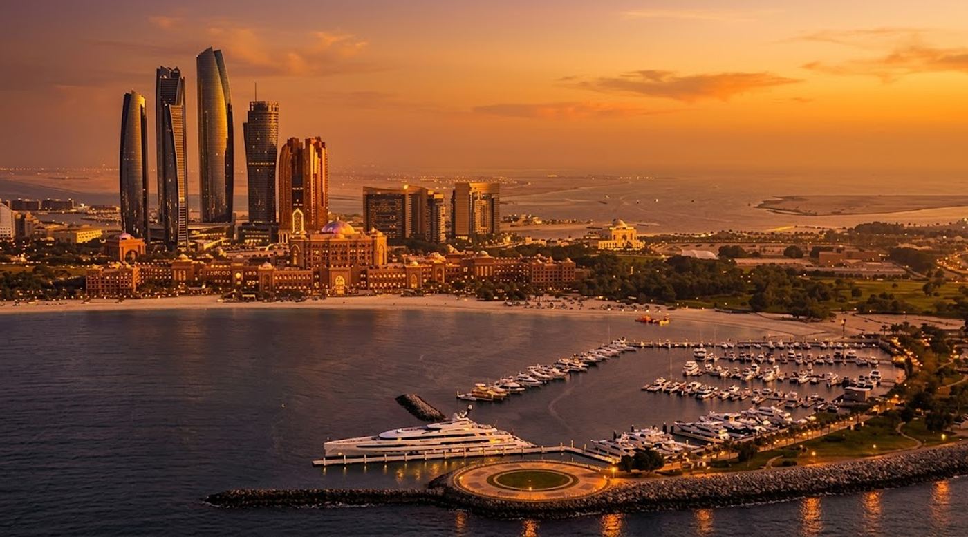 Abu Dhabi skyline and Emirates Palace at sunset