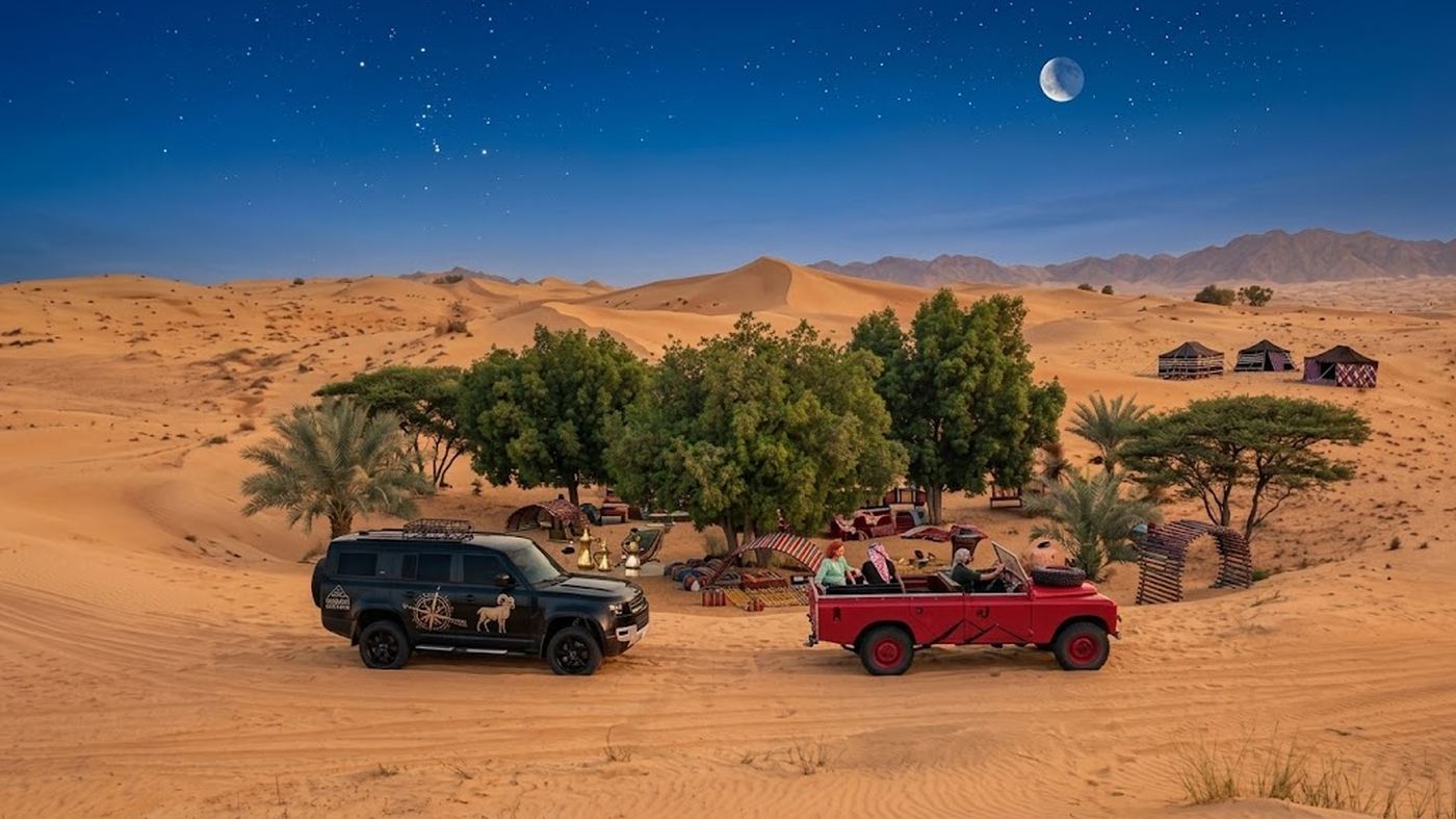 Private luxury vehicles at desert oasis camp